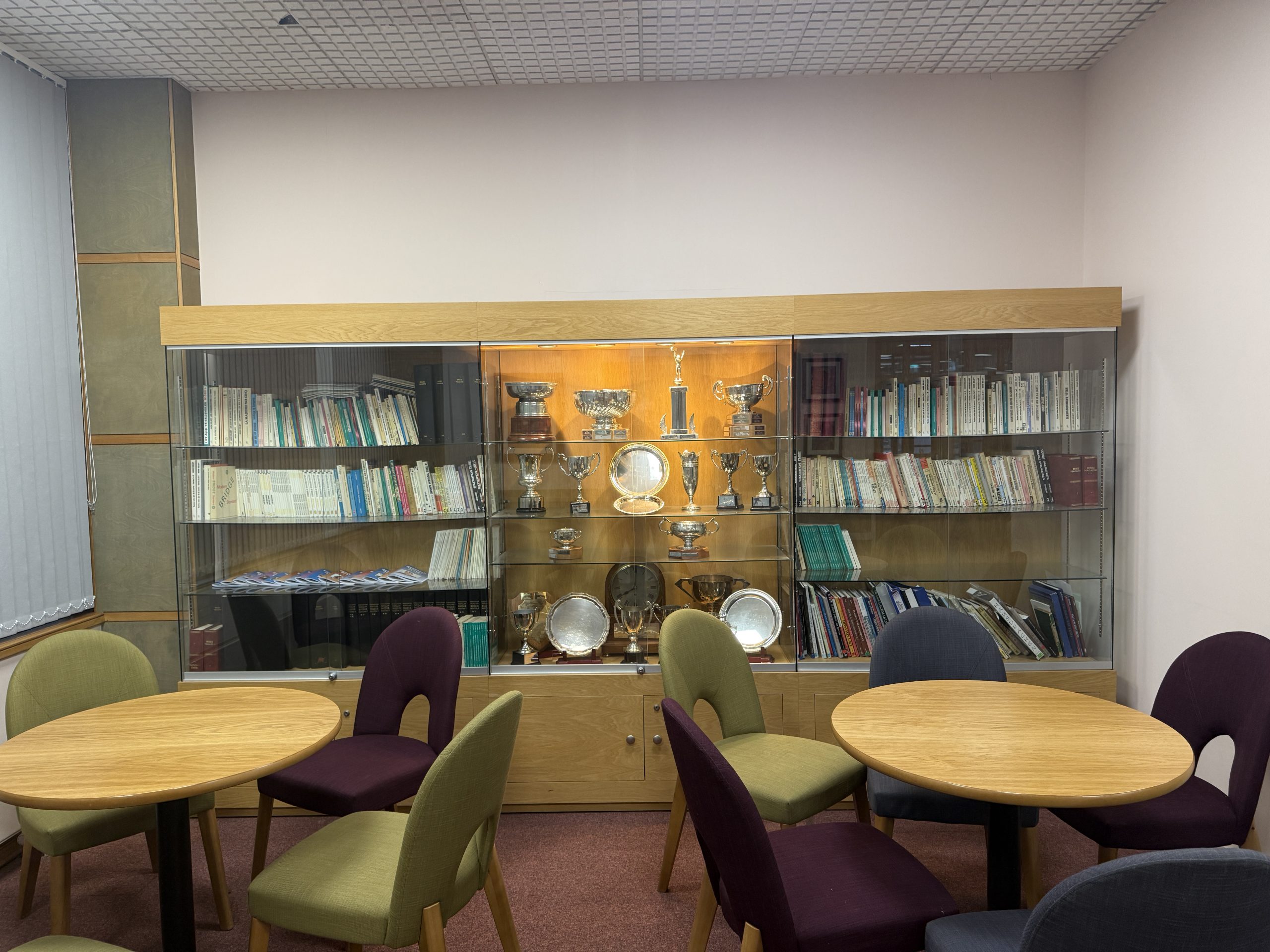 Our trophy cabinet and Hugh Kelsey library